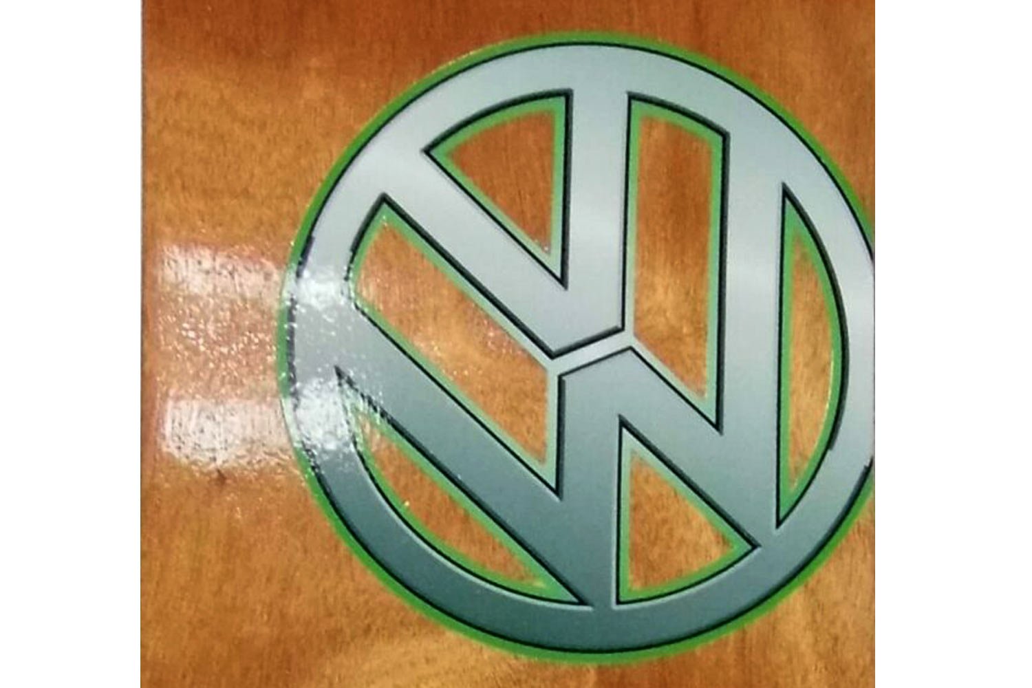 The VW logo with green glow